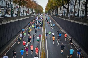 A group of people running a marathon race.